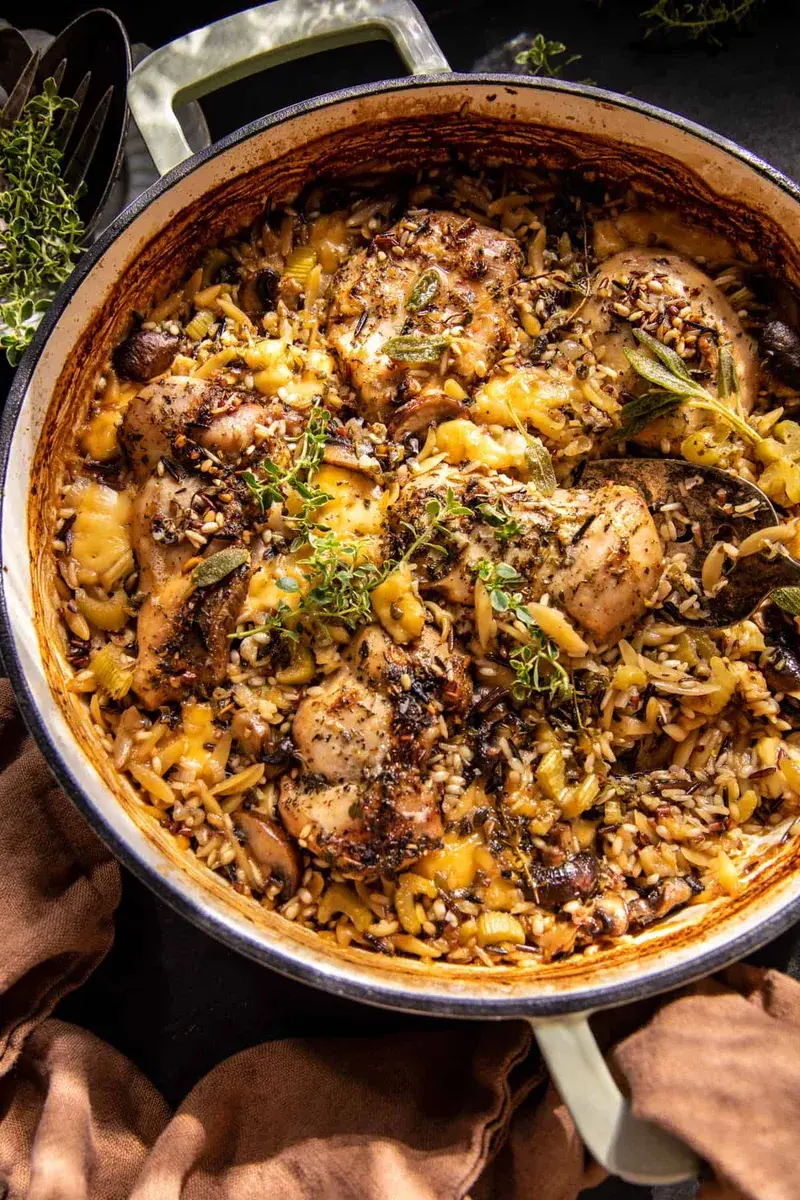 Baked chicken thighs over wild rice with mushrooms, celery and melted gouda